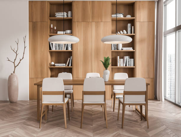 istock Front view on bright living room interior with dining table 1424833348