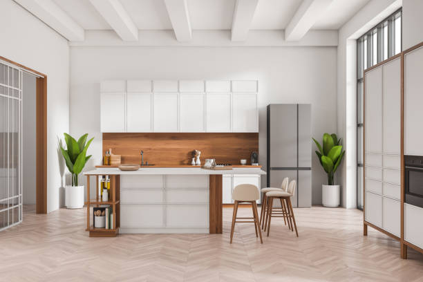 istock Stylish kitchen interior with bar island and seats, shelves and kitchenware 1424833520