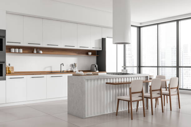 istock Corner view on bright kitchen room interior with island 1424833561