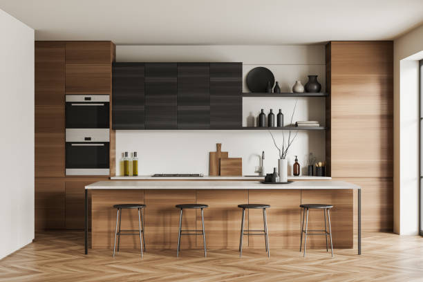 istock Light kitchen interior with island and seats, shelves and kitchenware 1424833611
