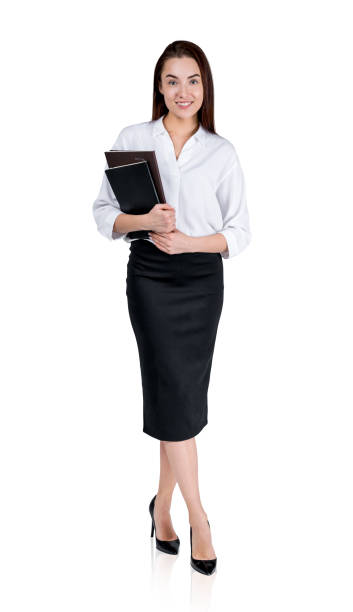 istock Young businesswoman with notebook, smiling isolated over white background 1424834275