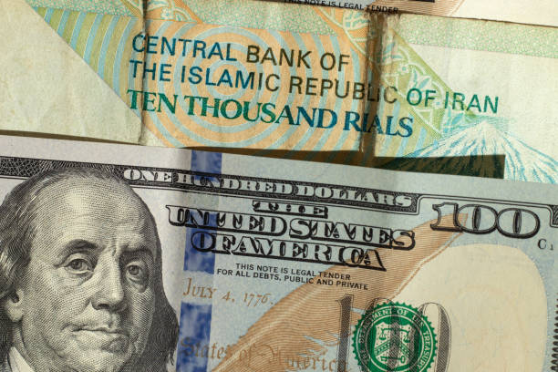 american dollars and iranian rials. - iranian currency imagens e fotografias de stock