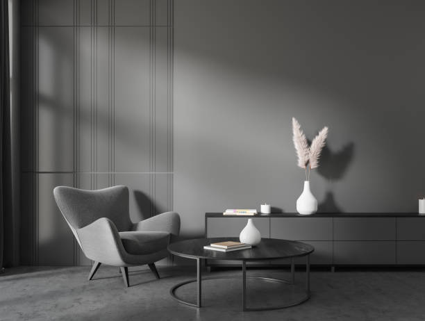 istock Grey chill interior with chair and coffee table, mockup wall 1424835067