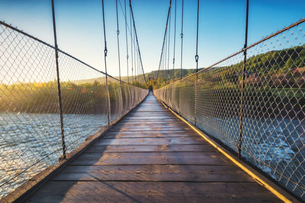 istock Suspension bridge over the river 1424836504