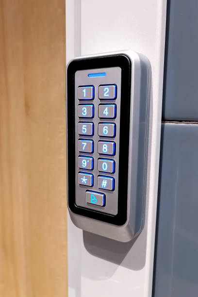 istock Black metal electric code lock with the digital keypad and card access near the house entrance door 1424837355
