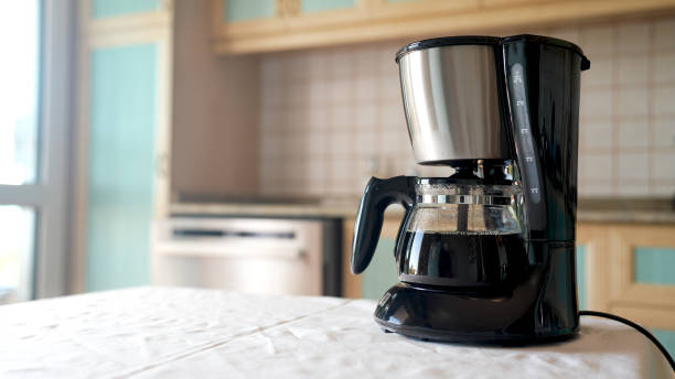 istock fresh brewed coffee pouring from the coffee machine 1424837696