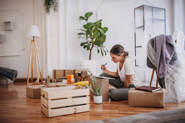 istock Woman sitting in new home 1424837747