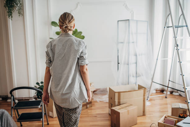 istock Woman in new apartment 1424837871