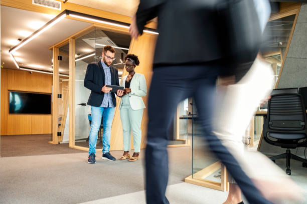 istock Business People Walking Down The Hallway 1424841741