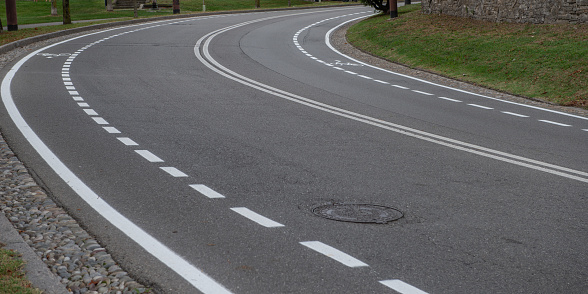 Asphalt road with bike lane stripes