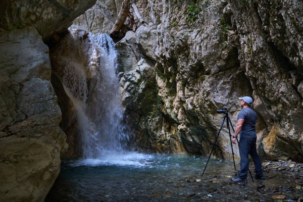 istock Nature photographer in a canyon 1424849109