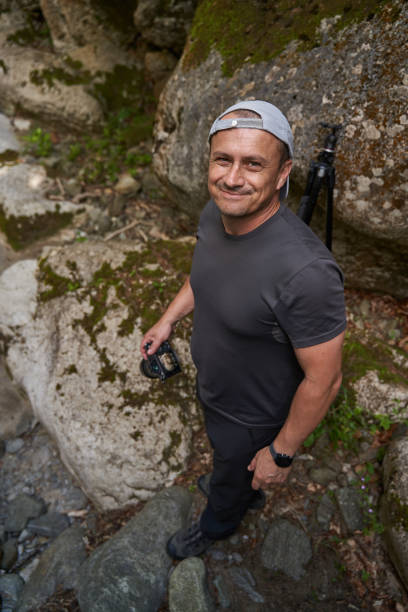 istock Nature photographer in a canyon 1424849112
