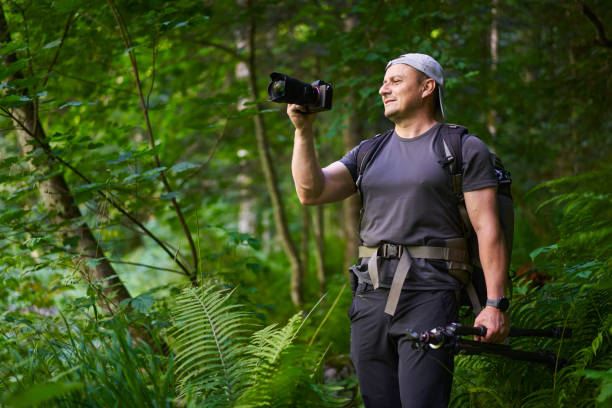 Nature photographer hiking in the forest