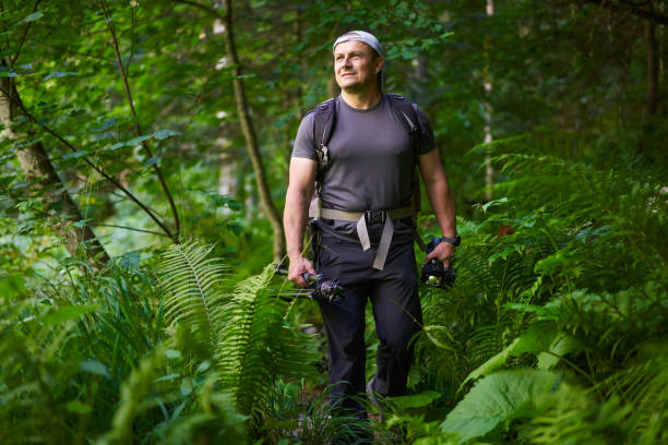 istock Nature photographer hiking in the forest 1424849169