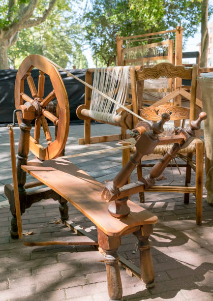 istock classic wooden spinning wheel from the 13th and 9th centuries 1424857705