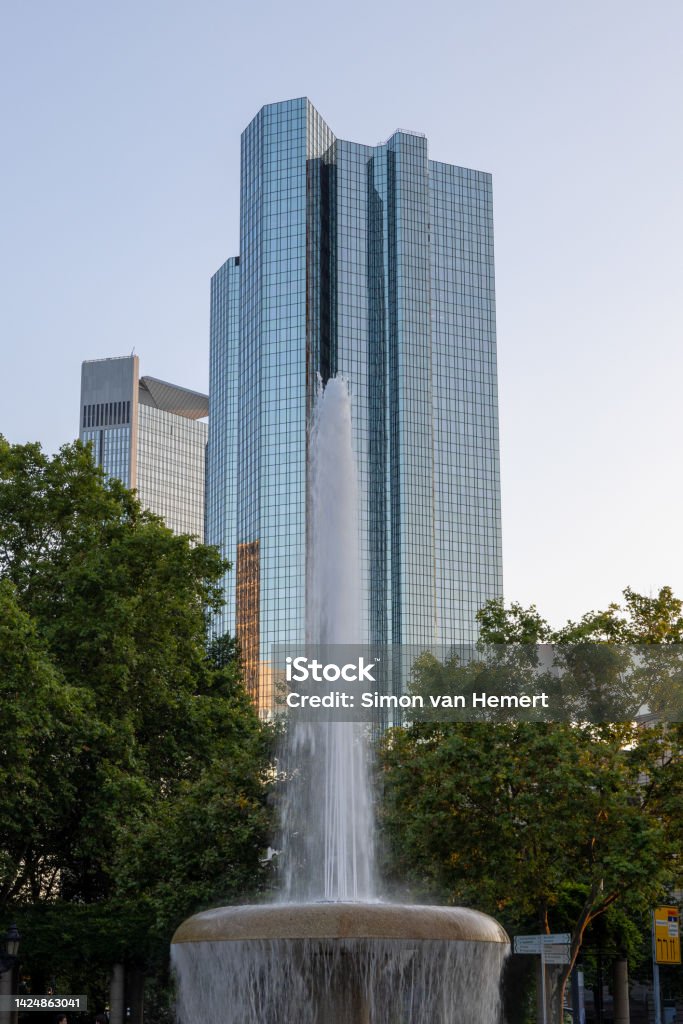 The Lucae Brunnen fountain in Frankfurt, Germany The Lucae Brunnen fountain in Frankfurt, Germany, with the twin towers in the background Architecture Stock Photo