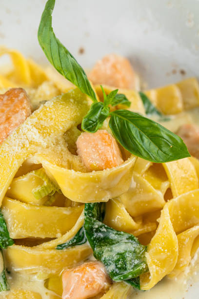 istock brown background and white bowl Spaghetti carbonara with brown mushroom 1424863566