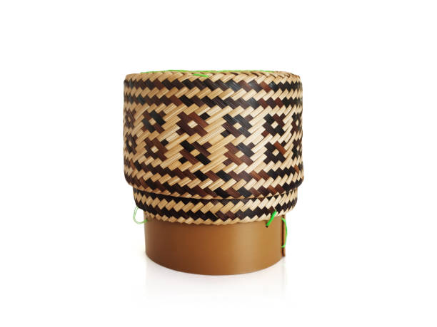 istock Wooden bamboo traditional style box with Thai sticky rice on white background 1424864509