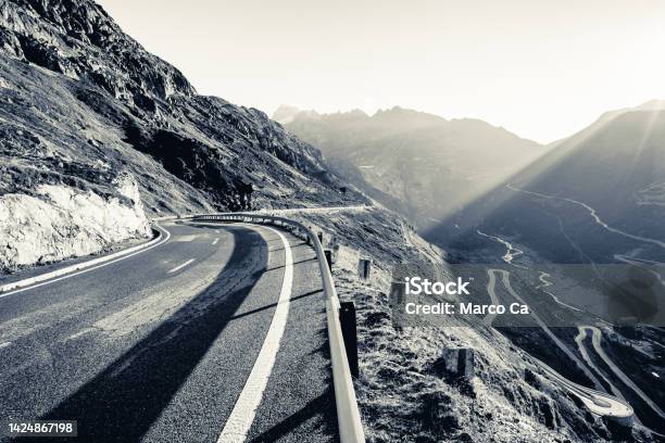 View Of A Mountain Road Just After Sunrise In The Swiss Alps Stock Photo - Download Image Now