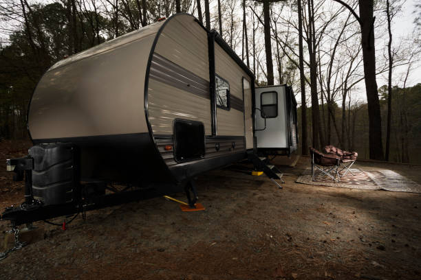 istock Chairs near a camping trailer 1424870335