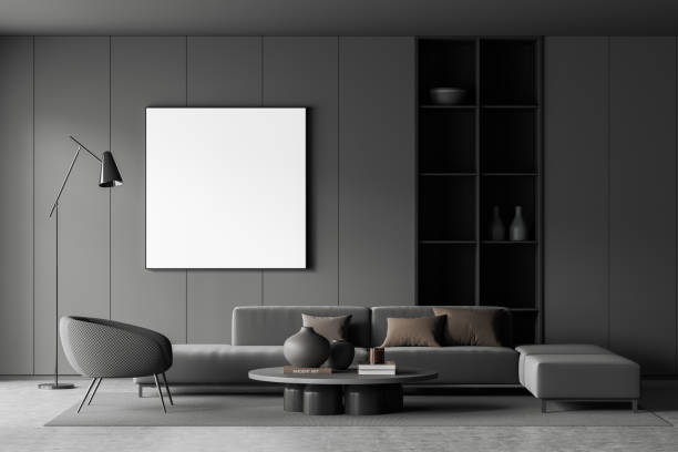 istock Grey relax room interior with couch and armchair, shelf and mockup frame 1424870735