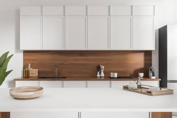 istock Light countertop on background of cooking area with kitchenware. Mockup 1424871564