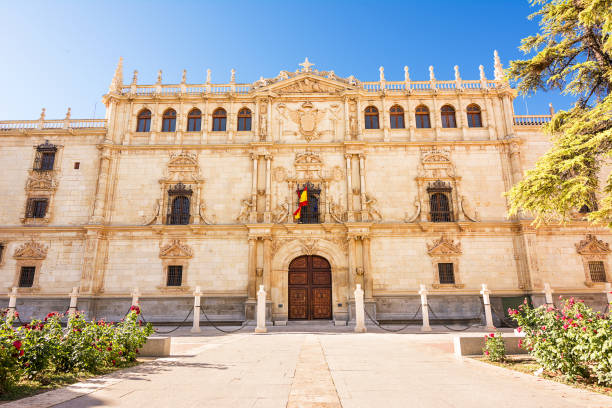 Facade of the building of the College of Saint Ildefonso, seat of the University of Alcala de Henares Facade of the building of the College of Saint Ildefonso, seat of the University of Alcala de Henares alcala de henares stock pictures, royalty-free photos & images