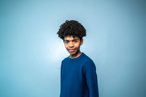 istock Portrait of a boy on a blue background 1424873735