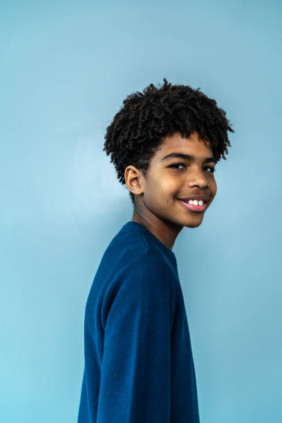 istock Portrait of a boy on a blue background 1424873768