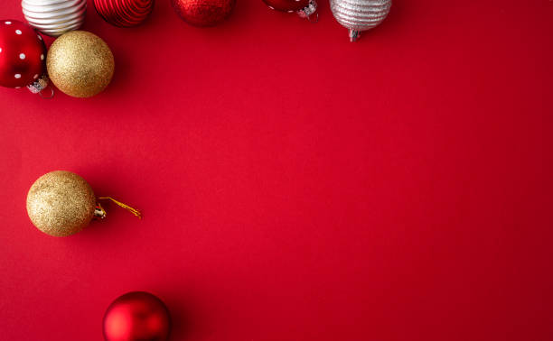 istock Christmas gift, decoration, ornaments flat lay on red background 1424873827