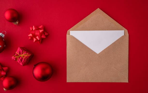 istock Christmas gift, decoration, ornaments flat lay on red background 1424873830