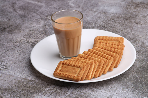 Cutting Chai, Traditional Desi Roadside tea of india with biscuits.