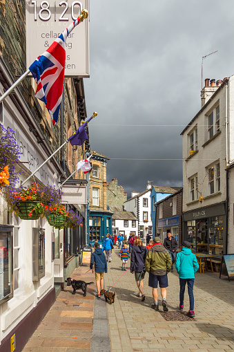 Keswick, Cumbria, UK - 16 August 2018: Historic architecture and surrounding shops in Main Street Keswick.