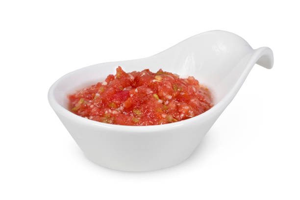 istock Tomato sauce or Ajvar and tomatoes isolated on a white background. 1424877445