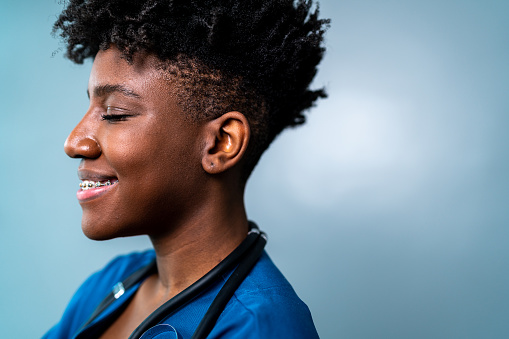 Young nurse / doctor on a blue background