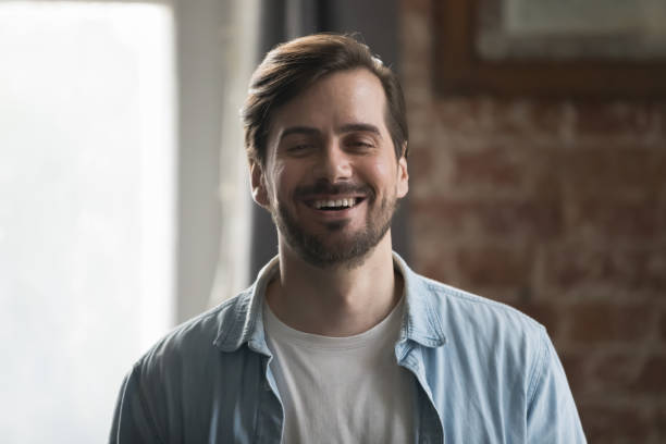 istock Happy confident man in casual denim shirt looking at camera 1424880500