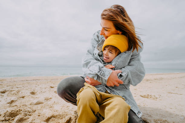istock Mother and son moments at the beach 1424880869