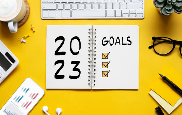 istock 2023 new year goal,plan,action concepts with text on notepad and office accessories.Business management 1424881109