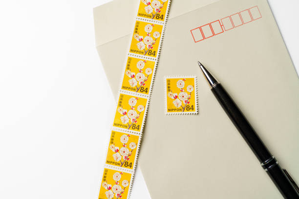 Envelope and Japanese postage stamp on white background