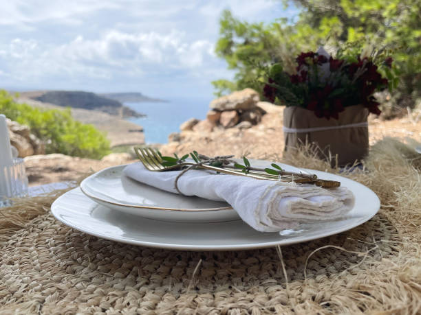 istock Romantic dinner overlooking the beautiful landscape and sea, on a beautifully picnic setting 1424882788