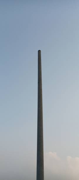 istock A towering iron pillar against a blue sky background. 1424883626
