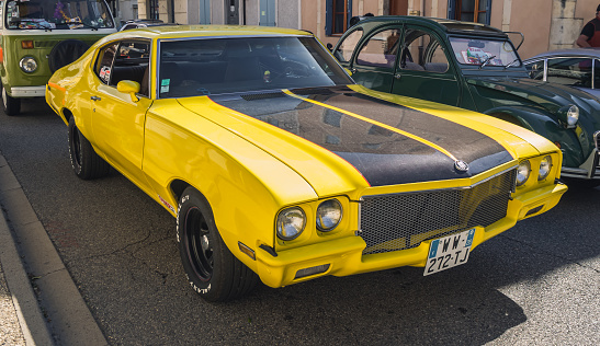 Loriol sur Drome, France - 17 September, 2022: Vintage yellow Buick Skylark, on the street. Classic car exhibition in Loriol sur Drome, France.