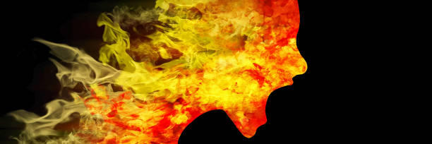 Silhouette of burning head as dramatic shot to mental problems and crises as 3d rendered illustration woman's head made of flames - part of a series hell stock illustrations