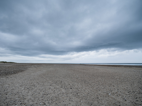 Svinkløv beach by Vesterhavet -  the North Sea, under ominous rain clouds