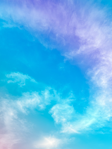 cloud and sky with a pastel rainbow-colored background