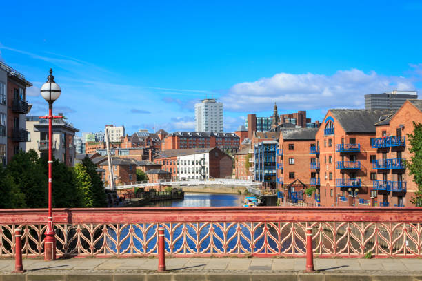 Apartments and bars overlooking the river Aire in Leeds city centre stock photo