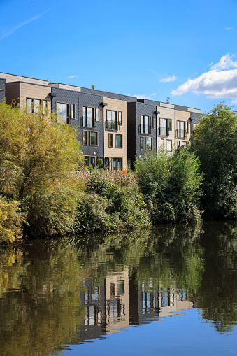 Modern eco housing by the River Aire in Leeds. This row of townhouses has been built using more sustainable resources and designed to use less energy than most houses.