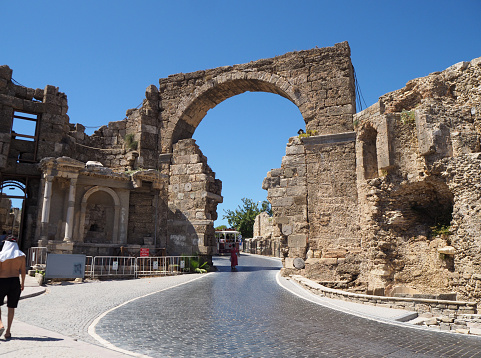 Entrance gate to the Side ancient city. Side, Manavgat, Antalya, Türkiye - August 2022.