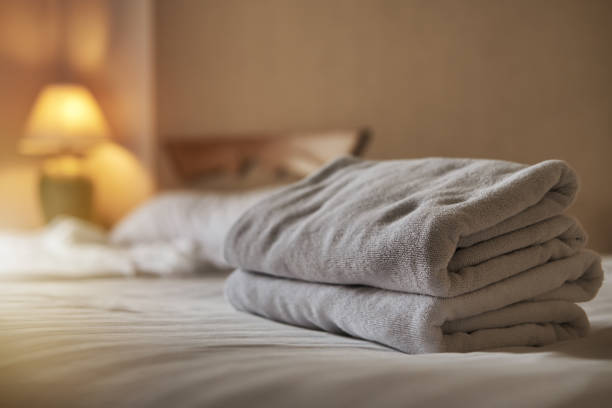 istock White towel on bed in the hotel room 1424906610