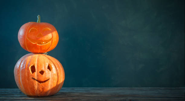 istock Halloween pumpkin on dark background 1424907161